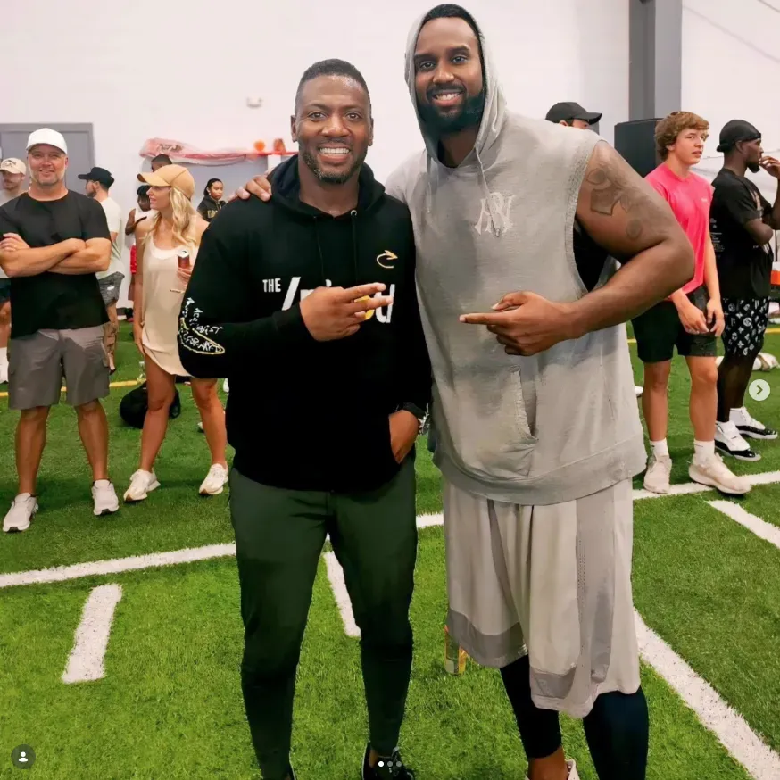 Tony Hills with Ryan Clark at an indoor football event